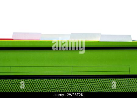 Closeup view of the colorful hanging file folder on the file organizer isolated over a white background Stock Photo