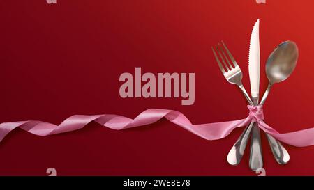 Silverware of fork, knife, and spoon tied up on pink ribbon over red background. Romantic dinner Valentine's Day concept Stock Photo