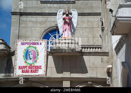 Statue on the roof of the Church of The Monastery of the Holy Eucharist, also known as the Our Lady of Lindogon Shrine and commonly known as the Simal Stock Photo