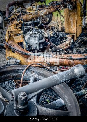 Close-up of the remains of a burnt-out moped Stock Photo