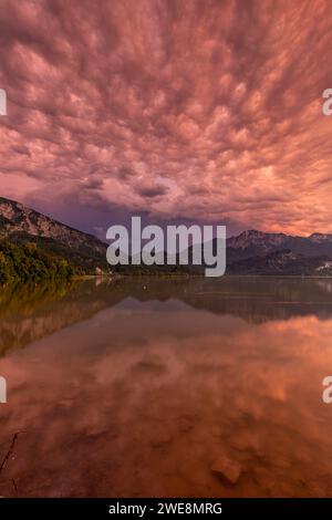 Dramatic clouds, thunderstorm over a lake in front of mountains, Lake Kochelsee, summer, Upper Bavaria, Bavaria, Germany, Europe Stock Photo