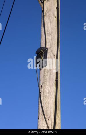 A method of keeping aerial wires tensioned and up on the poles they were attached to and is made of moulded plastic. Stock Photo