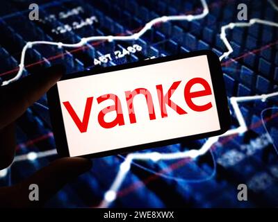 Konskie, Poland - January 23, 2024: Vanke company logo displayed on mobile phone screen Stock Photo