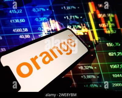 Konskie, Poland - January 23, 2024: Orange company logo displayed on mobile phone screen Stock Photo