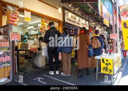 Tokyio Japan January 2024 People Among Stalls Selling Fresh Fish At   Tokyio Japan January 2024 People Queuing To Buy Food At Stalls At The Tsukiji Outer Market In The City Centre 2we90fa 