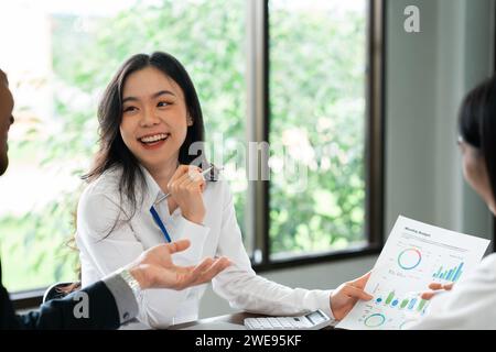 Smiling multiethnic employees have fun brainstorming at meeting Stock ...