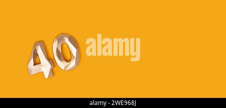 Banner with golden number 40 on a yellow background. Place for text. Stock Photo