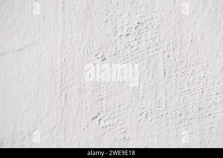 Rustic white wall to use as backgrounds in design work. Stock Photo