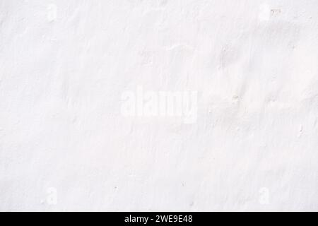 Rustic white wall to use as backgrounds in design work. Stock Photo