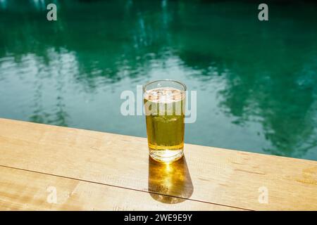 Selective focus drink alcohol and water glass with beer and Sparking water and ice cube. Ice beer, Thai people like to drink beer on the ice. Draft be Stock Photo