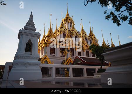 Stunning view of the Wat Ratchanatdaram, a beautiful Buddhist temple that stands proud in the heart of downtown Bangkok, Thailand. Stock Photo