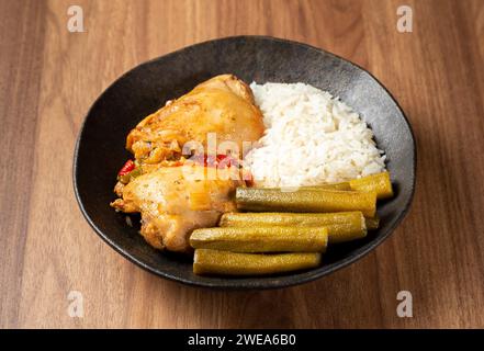 Chicken with okra and rice. Typical Brazilian dish. Stock Photo