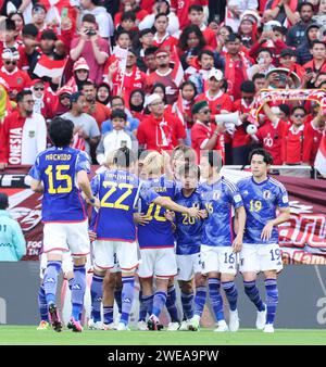 Doha. 24th Jan, 2024. Players of Japan celebrate scoring during the Group D match between Japan and Indonesia at AFC Asian Cup Qatar 2023 at Al Thumama Stadium in Doha, Qatar, Jan. 24 2024. Credit: Ding Ting/Xinhua/Alamy Live News Stock Photo