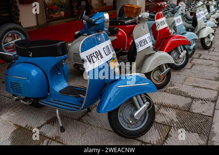 Udine, Italy (7th January 2024) - Old Vespa motorbikes of different colours aligned in the city center Stock Photo