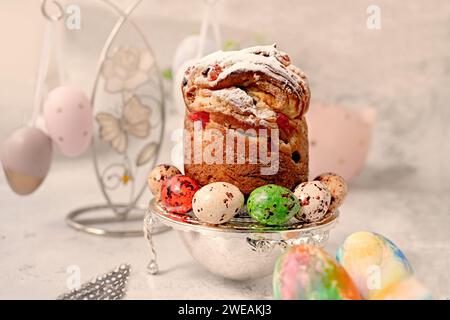 Happy easter. Modern Easter figurines, Easter painted eggs and egg-shaped candies on the table. Stylish holiday table decor. Naturally dyed Easter egg Stock Photo