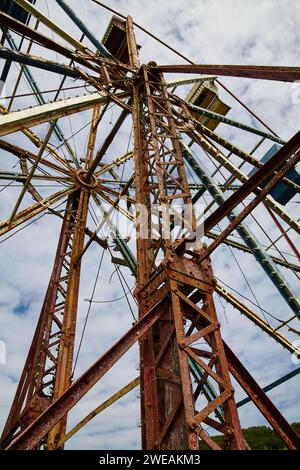 Rusting Ferris Wheel in Abandoned Theme Park, Low-Angle View Stock Photo