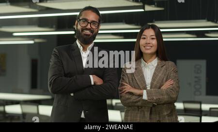 Portrait multiethnic business people standing in office teamwork two diverse colleagues employees co-workers Indian businessman Arabian man and Asian Stock Photo