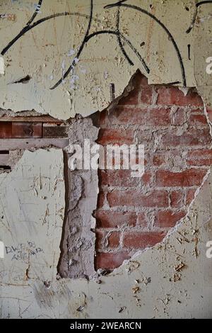 Graffiti on Weathered Brick Wall, Urban Decay Texture Close-Up Stock Photo