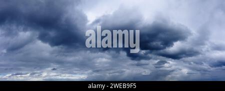 Dark rainy clouds in the stormy sky. Weather forecast. Sky panorama. Stock Photo