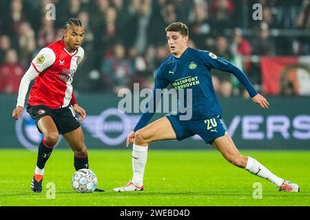 Rotterdam, Netherlands. 24th Jan, 2024. Rotterdam - Calvin Stengs of Feyenoord, Guus Til of PSV during the match between Feyenoord v PSV at Stadion Feijenoord De Kuip on 24 January 2024 in Rotterdam, Netherlands. Credit: box to box pictures/Alamy Live News Stock Photo