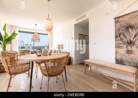 a luxury dining room area filled with wooden furniture in holiday apartment Stock Photo