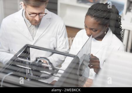 Two Diverse 3D Printer Engineers Working in Laboratory Stock Photo