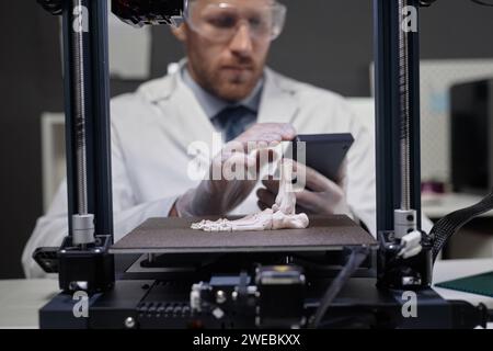 Technician Working on 3D Bone Prototype Stock Photo