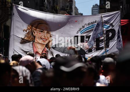 Members of trade unions carry a flag and march during a rally to call