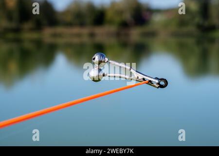 bell alarm is on fishing rod spinning in nature bells of allure are  attached to the