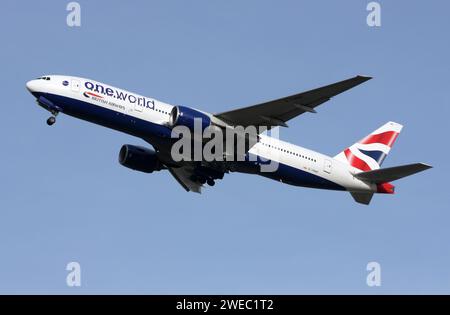 A Boeing 777-200 of British Airways bearing One world alliance titles departing London Gatwick Stock Photo