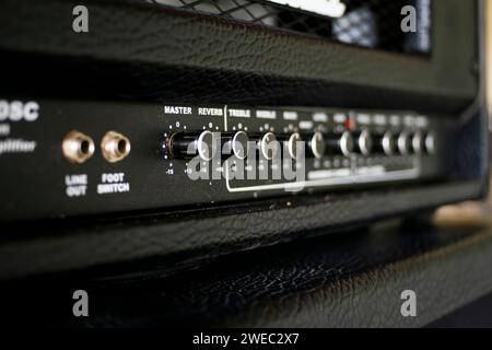 Close up electric guitar amplifier. Master regulator knob, volume level. Stock Photo