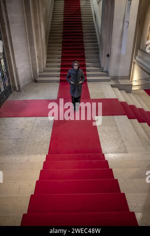 Woman Standing on Red Carpet on Staircase in Switzerland. Stock Photo