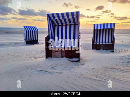 empty Beach chairs on the beach at sunset, Germany, Lower Saxony, Norderney Stock Photo