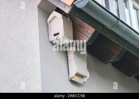 nesting aids for swifts and bats on a house facade under the roof, Germany Stock Photo