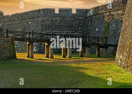 Drawbridge approach to sally port of  Castillo de San Marcos fortification at sunset Stock Photo