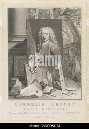 Portrait of Cornelis Troost, Jacob Houbraken, After Cornelis Troost, 1760 - 1780 print Portrait to the left of the painter Cornelis Troost. The painting with its portrait stands on an easel on a landing and is surrounded by the attributes of painting and engraving art. Under the donkey are the palette and brushes, a sculpted head, drawing markers, books and drawings. On the left is the painter's stick, on which a laurel wreath hangs. Behind it a painting in frame. In the background a glimpse to a landscape. Under the performance the name and data of the portrayed person in three lines in Dutch Stock Photo