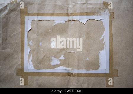 Peeled white paper on kraft paper envelope texture background Stock Photo