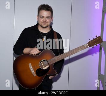 Anaheim, USA. 24th Jan, 2024. Hunter Hayes, playing a Martin GPCE Inception Maple guitar during the NAMM Show Global Media Day held at the Anaheim Convention Center on January 24, 2024 in Anaheim, CA. © Tammie Arroyo/AFF-USA.com Credit: AFF/Alamy Live News Stock Photo