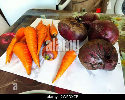 Fresh vegetables carrots and beets on a table Stock Photo