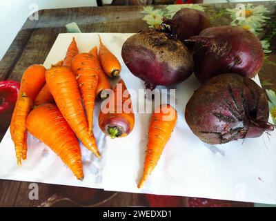 Fresh vegetables carrots and beets on a table Stock Photo