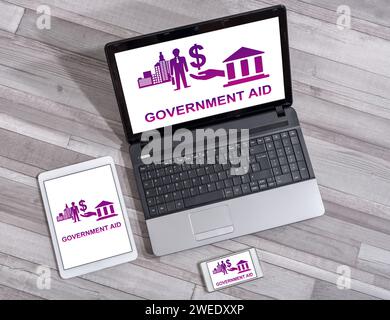 Government aid concept shown on different information technology devices Stock Photo