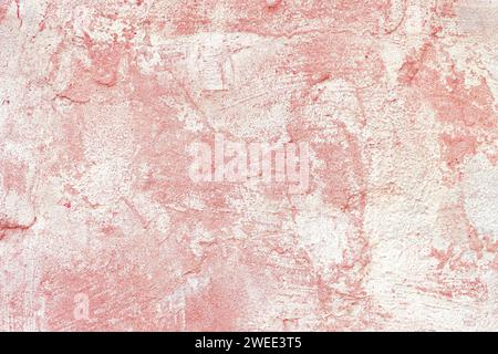 Vintage, old stucco plaster surface background, close up rough texture of red and white mixed color painted cement, concrete wall texture. Wallpaper, Stock Photo