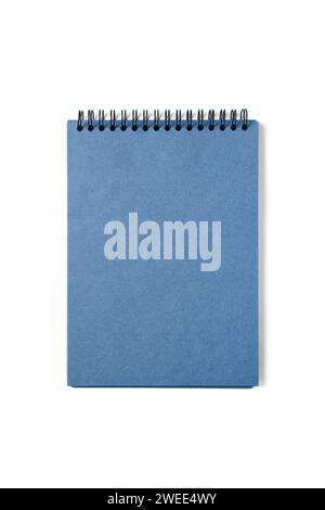 Open spiral bound notepad with craft blue sheets, isolated on white background. Top view, copy space for text, template, mockup Stock Photo