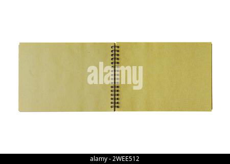 Open spiral bound notepad with two craft yellow sheets, isolated on white background. Top view, copy space for text, template, mockup Stock Photo