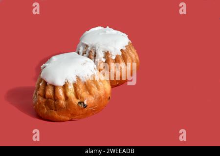 Two butter cakes with vanilla, raisins, soaked in rum called baba. Stock Photo