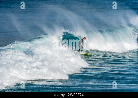 Surfing the wave in Carrapateira, Portugal Stock Photo