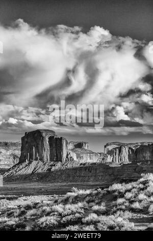 Clouds over Elephant Butte, a sandstone monolith in the Monument Valley Navajo Tribal Park in Arizona. Stock Photo