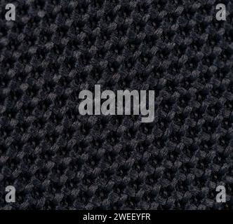 Dark braid knit craft background macro clsoe up view Stock Photo