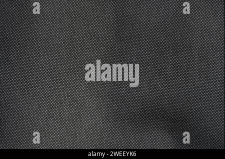 Soft black textile surface macro close up view. Fibre decoratrion background Stock Photo