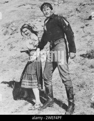 Joel McCrea and Virginia Mayo star in 'Colorado Territory' (1949), a Western film directed by Raoul Walsh. In this movie, McCrea plays Wes McQueen, an outlaw seeking redemption, while Mayo portrays Colorado Carson, his accomplice and love interest. Set against the backdrop of the American frontier, the film is a tale of crime, betrayal, and romance. Stock Photo